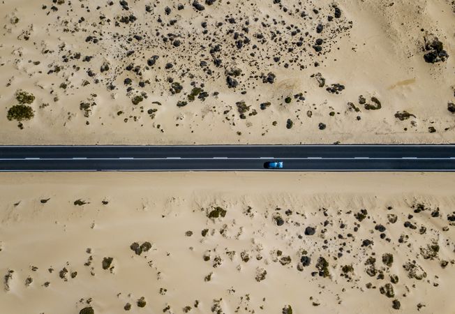 Car driving on road in picturesque desert