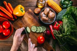 Vegetables and utensils on kitchen table
