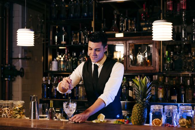 Barman working making drinks