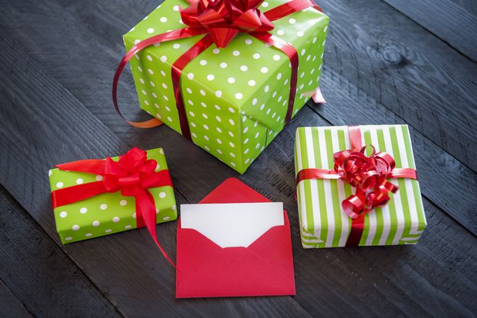 Wrapped Christmas gifts tied with red ribbon