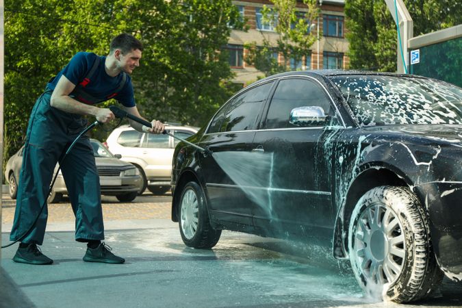 A man washes a car. Clear car concept