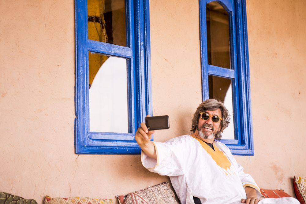 Man sitting on oriental stone terrace