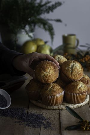 Fresh tasty muffins on table decorated with berries