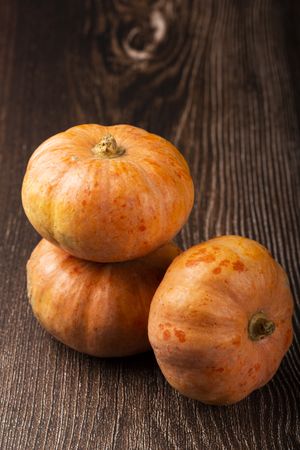 Pumpkins on the wooden table.