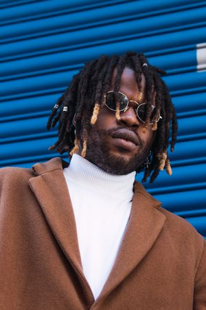 Black man in trendy sunglasses in city