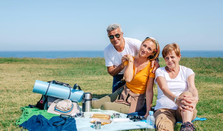 Adult family enjoying a scenic picnic