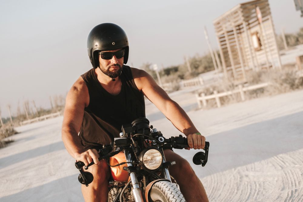 Strong man driving motorcycle