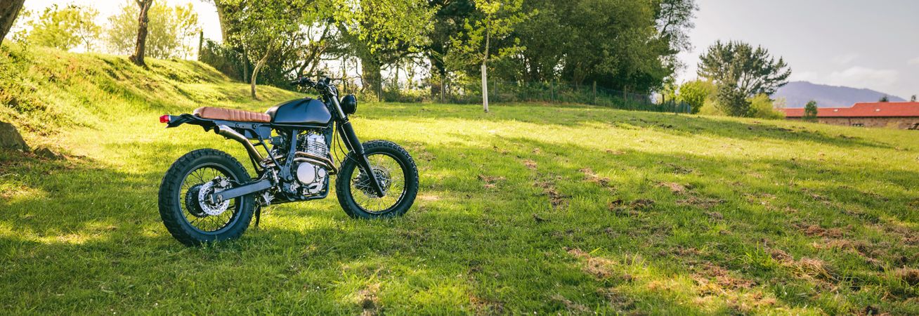 Custom motorcycle parked on the field