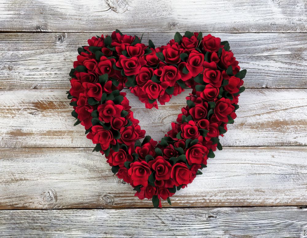 Wooden Valentine’s day wreath on aged wood