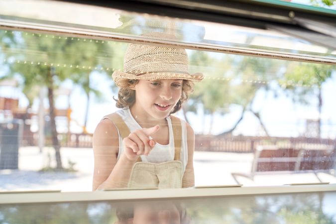 Positive child choosing ice cream