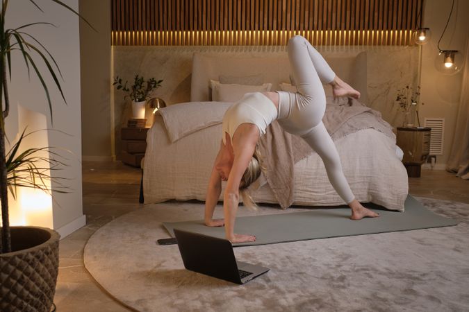 Woman doing gymnastics in modern room