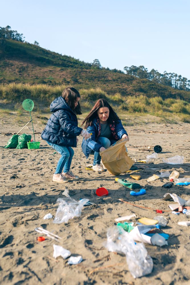 Female volunteers cleaning the beach