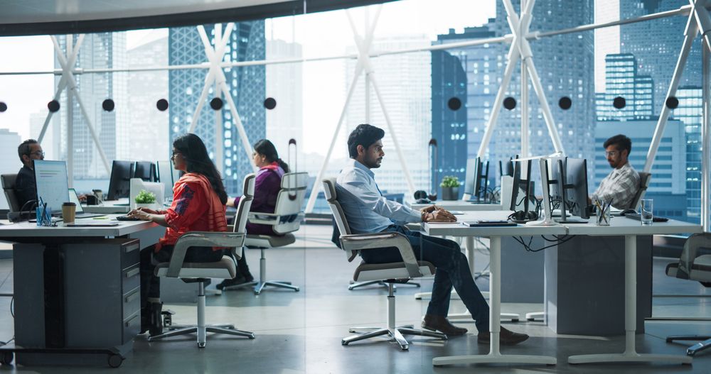 Team of Talented Young Indian Professionals Working in a Business Research and Development Agency.