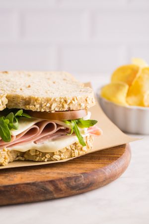 Delicious sandwich with ham, cheese, lettuce and tomato
