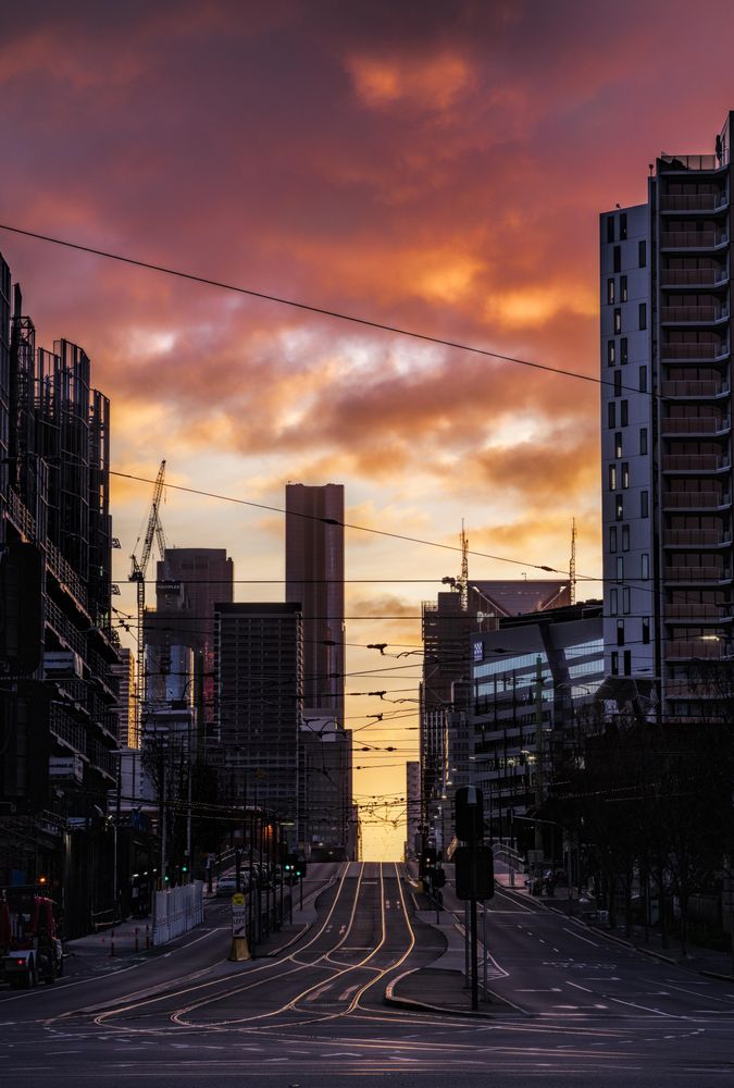 Cars on road in the city Melbourne, Australia at sunset