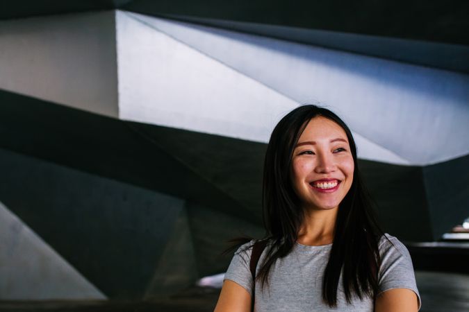 Cheerful Asian woman looking at camera
