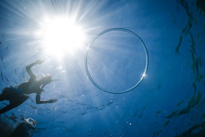 Unrecognizable boy preparing to dive in sea