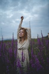 Romantic women in salvia field