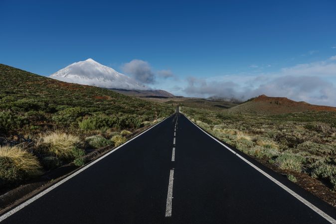 Countryside road near snowy mountain peak