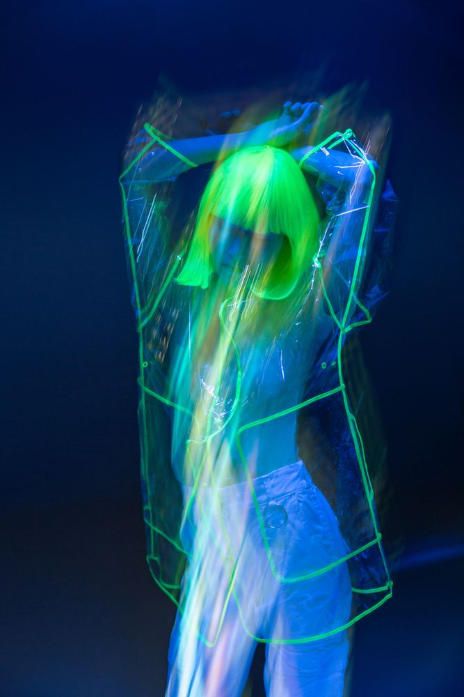 Asian woman posing in fluorescent light