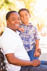 Portrait of Happy Son and Father Outside Together.