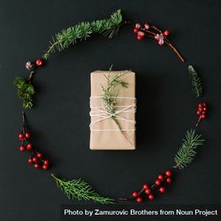 Christmas wreath and present made of winter items on dark background 5kvXG0