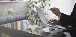 Businessman Working on Laptop at Office Desk