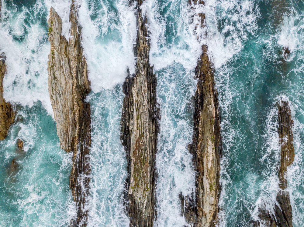 Stone ridges on high seas in stormy day