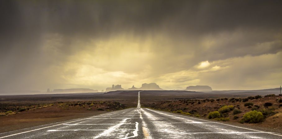 Cloudy sky over countryside road
