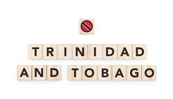 Wooden blocks bearing the name and flag of Trinidad And Tobago. Trinibagonian and Caribbean Culture, national identity, travel, and geography in a copy space design.