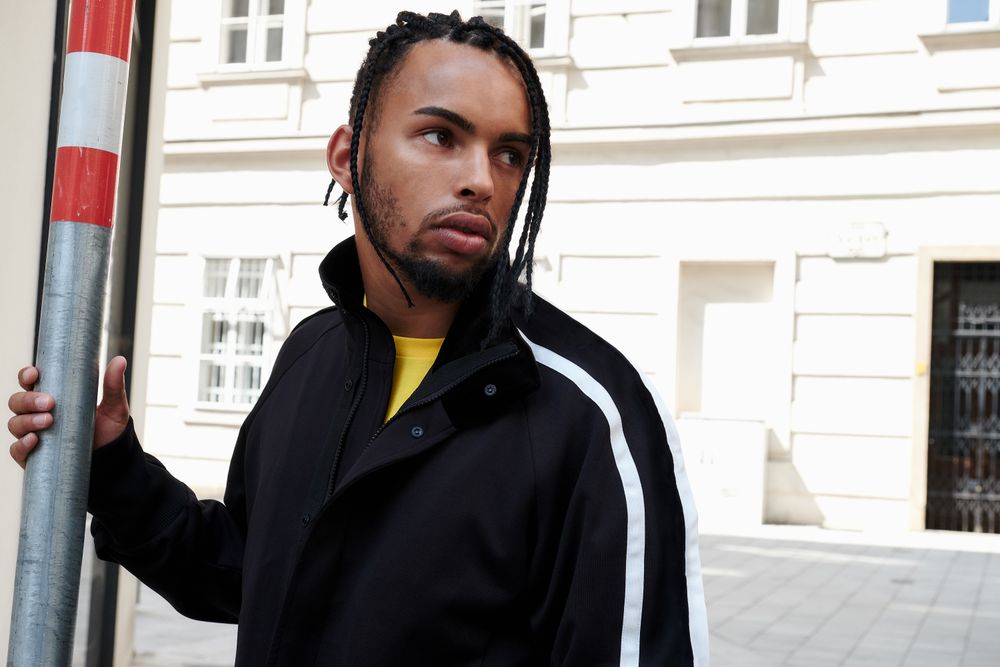 Black male standing outside