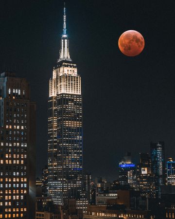 Empire State building under full blood moon
