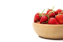 Bowl with tasty strawberry isolated on blank background. Summer berry