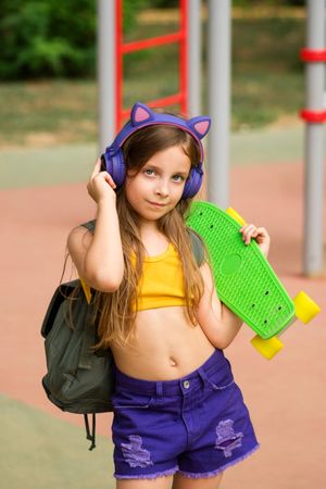 Girl holding Skateboard