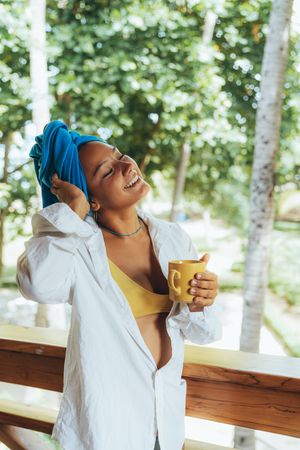 Woman in turban drinking coffee