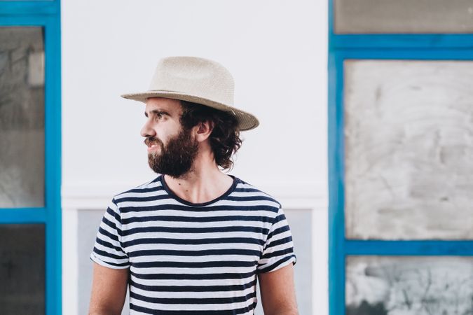 Young male in hat and striped t-shirt