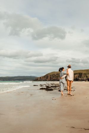 Happy couple having fun on Scottish coast