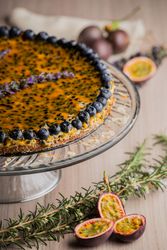 Tasty passion fruit pie decorated with blueberry