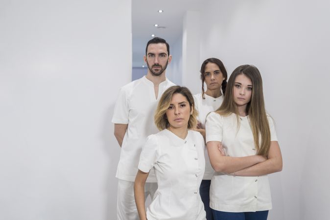 Portrait of serious medical staff standing in hospital hall