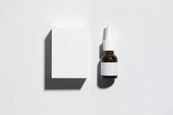 Mockup of a box and an amber glass bottle
