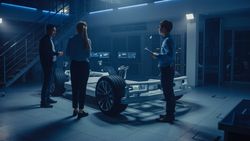 Team of Automobile Design Engineers in Automotive Innovation Facility Working on Electric Car