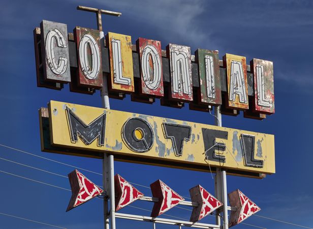 A well-worn neon sign for the Golden Desert Motel on historic U.S. Route 66