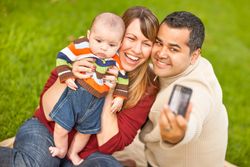 Parents and Baby Boy Taking Self Portraits at the Park