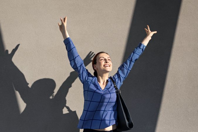 Excited businesswoman jumping