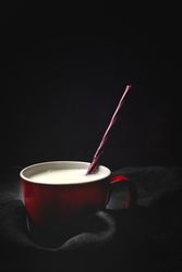 Cup of milk on table