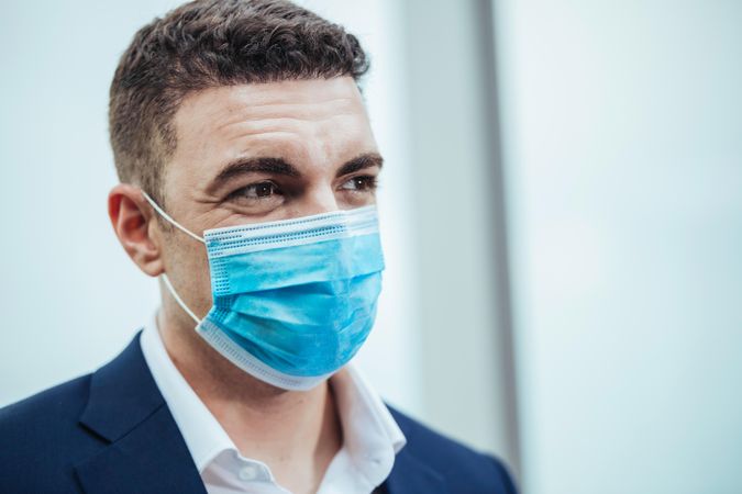 Portrait of business man wearing medical protective mask