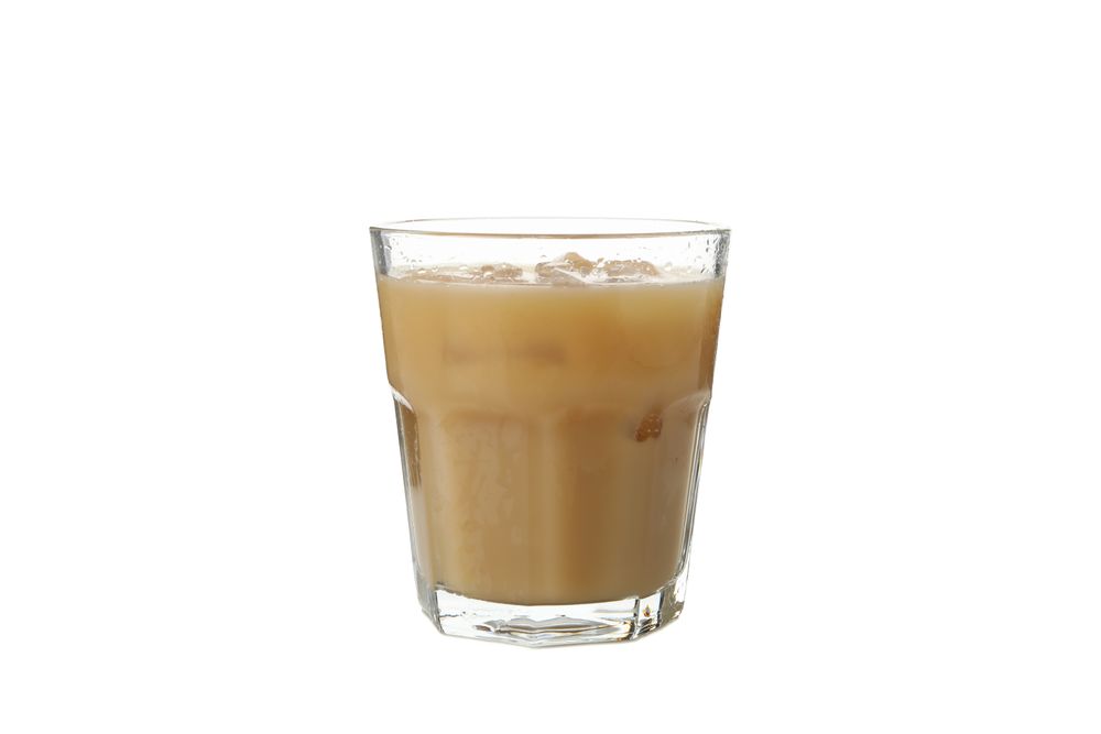 Glass of ice coffee isolated on plain background