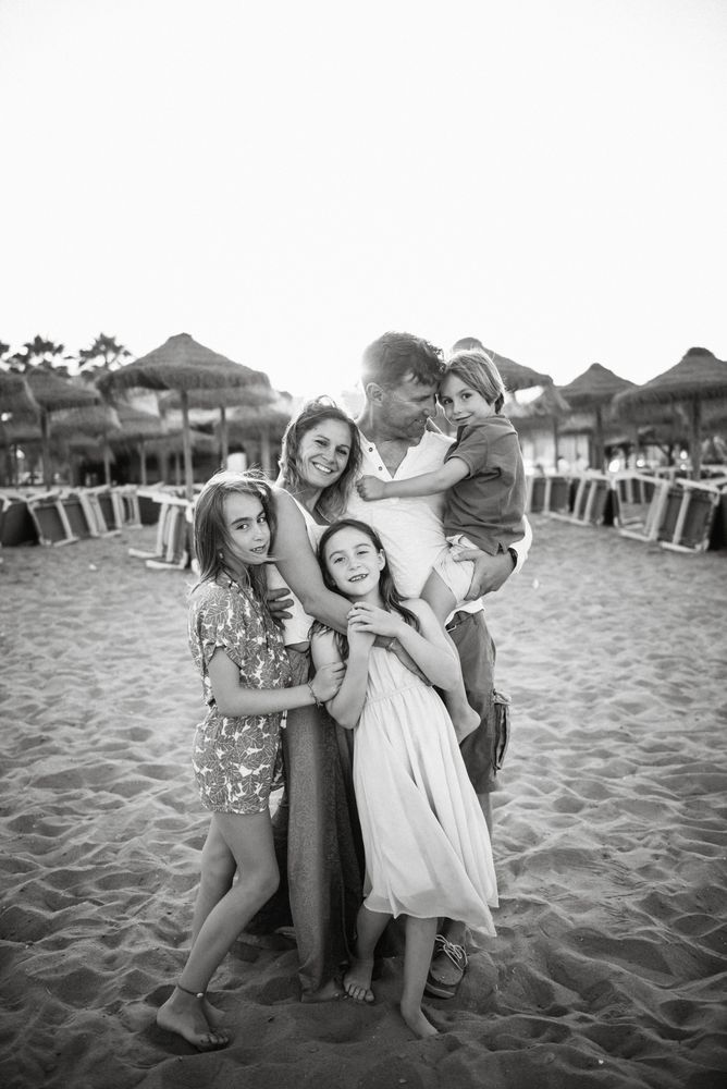 Beautiful happy family with children on beach
