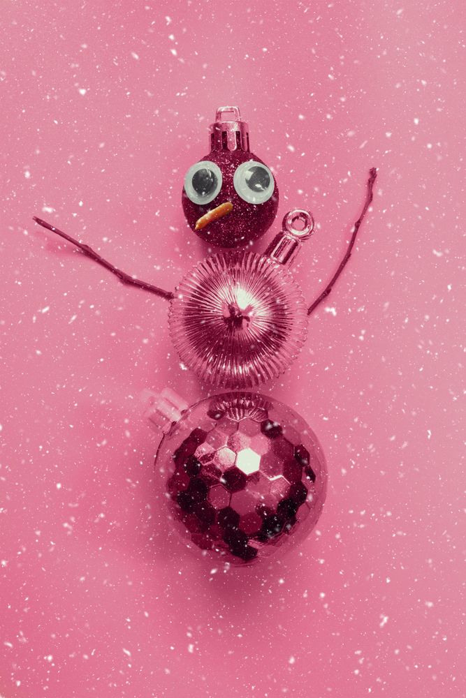Pink snowman made out of Christmas decorations