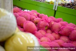Pear fruit pack wrapped in pink and for sale in market store 4ZePzr
